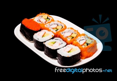 Sushi In White Plate On Black Background Stock Photo