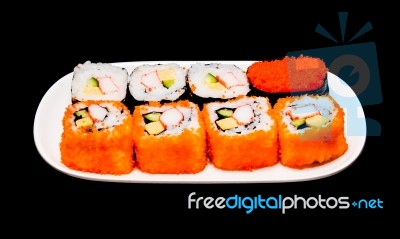 Sushi In White Plate On Black Background Stock Photo