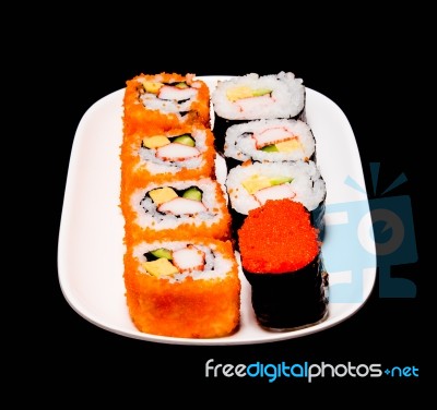 Sushi In White Plate On Black Background Stock Photo