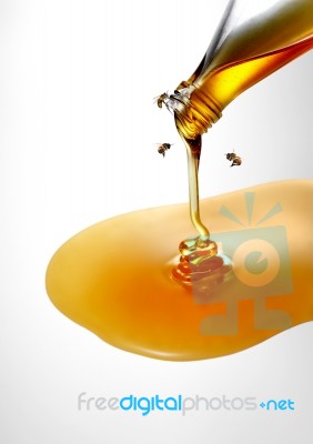 Sweet Honey From Bottle With Bees Stock Photo