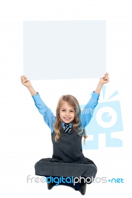 Sweet Kid Holding Blank Ad Board Above Her Head Stock Photo