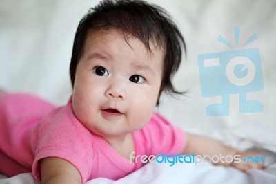 Sweet Newborn Baby Lies On Bed Stock Photo