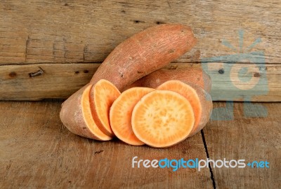 Sweet Potato On The Wooden Background Stock Photo