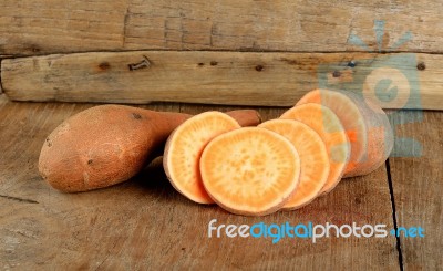 Sweet Potato On The Wooden Background Stock Photo