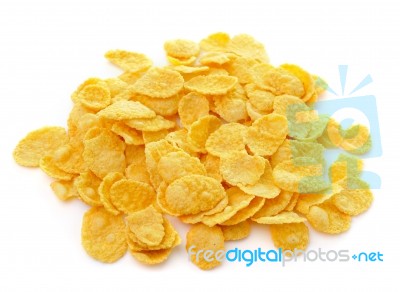 Sweet, Tasty Cornflakes, Dry Crispy On White Background Stock Photo