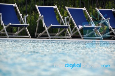 Swimming Pool Chairs Stock Photo