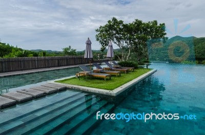 Swimming Pool With Mountain, Thailand Stock Photo