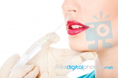 Syringe And Lips Stock Photo