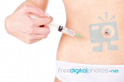 Syringe On Woman's Stomach Stock Photo