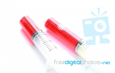 Syringe With Red Liquid Isolated On White Background Stock Photo