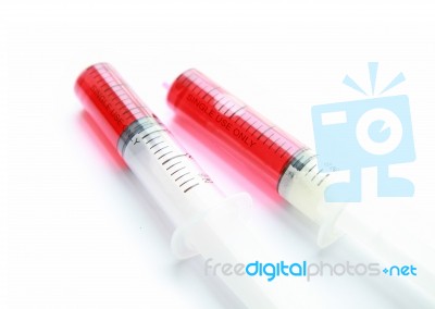 Syringe With Red Liquid Isolated On White Background Stock Photo