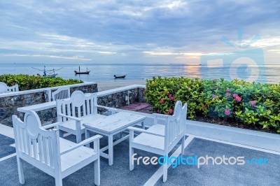 Table And Chairs Set On Balcony Near The Beach Stock Photo