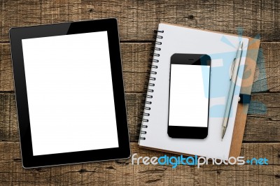 Tablet And Smartphone On Wood Background Stock Photo