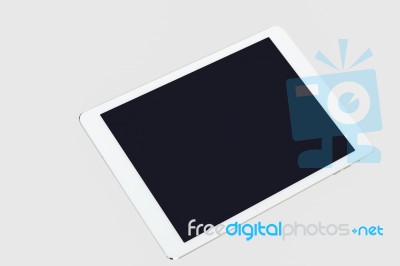 Tablet Computer On Grey Background Stock Photo