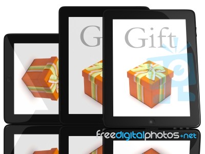 Tablet Computer With Gift Stock Photo