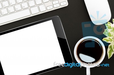 Tablet Digital On Work Desk Top View Stock Photo