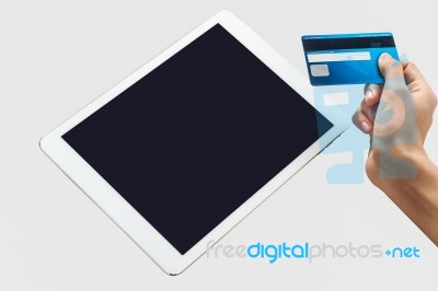 Tablet Pc With A Credit Card Stock Photo