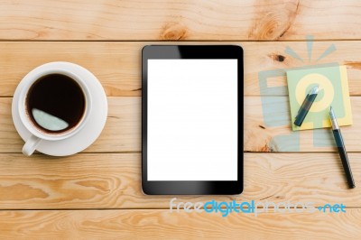 Tablet White Display And Coffee On Wood Workspace Stock Photo