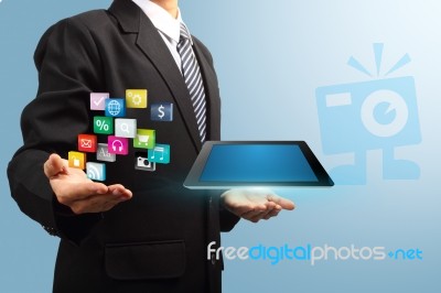 Tablet With Application Icons In The Hands Of Businessmen Stock Image