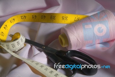 Tailor Tools On Pink Fabric Stock Photo