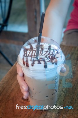 Take-home Ice Coffee Cup On Wooden Table Stock Photo