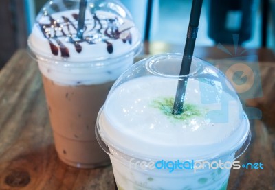 Take-home Ice Coffee Cup On Wooden Table Stock Photo