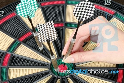 Taking Out Dart From Dartboard Stock Photo