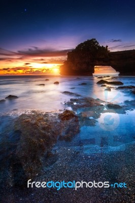 Tanah Lot Temple At Sunset In Bali, Indonesia Stock Photo