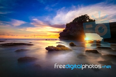 Tanah Lot Temple At Sunset In Bali, Indonesia.(dark)seascape Stock Photo