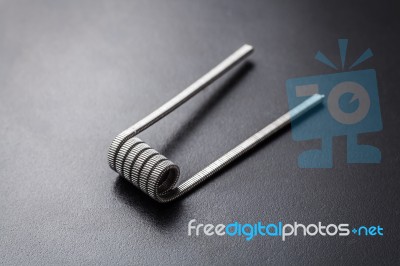 Tank Track Coil For Vaping On A Black Background Stock Photo