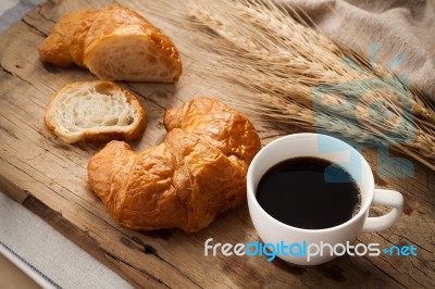 Tasty Croissant And Coffee Still Life Rustic Stock Photo