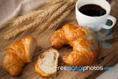 Tasty Croissant And Coffee Still Life Rustic Stock Photo