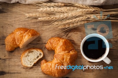 Tasty Croissant And Coffee Still Life Rustic Stock Photo