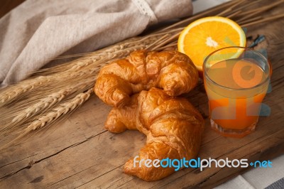 Tasty Croissant And Orange Juice Still Life Rustic Stock Photo