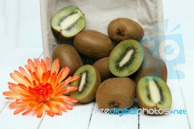 Tasty Kiwi Fruits Isolated On A White Wooden Background Stock Photo