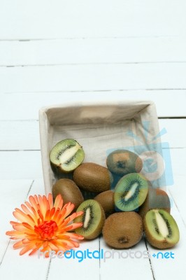 Tasty Kiwi Fruits Isolated On A White Wooden Background Stock Photo