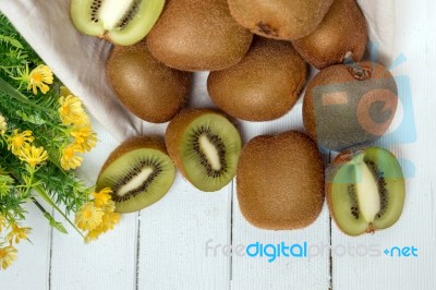 Tasty Kiwi Fruits Isolated On A White Wooden Background Stock Photo