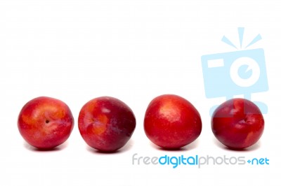 Tasty Red Plum Fruits Isolated On White Background Stock Photo