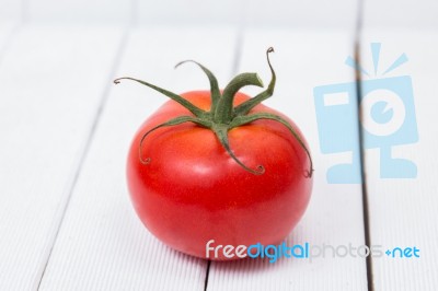 Tasty Tomato On A White Background Stock Photo