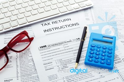 Tax Concept With Calculator And Computer Keyboard Stock Photo