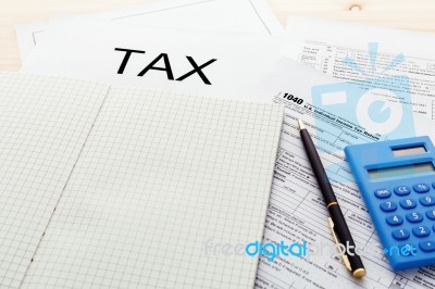 Tax Form With Blank Notebook Stock Photo