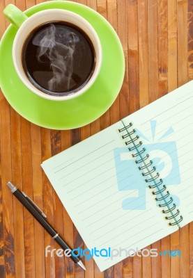 Tea Cup And Blank NoteBook Stock Photo