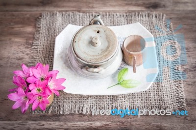 Tea Cups With Teapot On Old Wooden Table Stock Photo