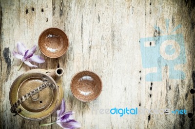 Tea Cups With Teapot On Old Wooden Table. Top View Stock Photo