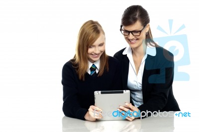 Teacher And Student Busy In Tablet Device Stock Photo