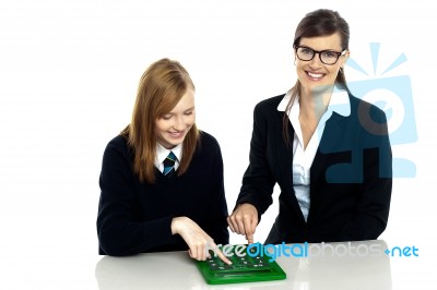 Teacher And Student Working On Calculator Stock Photo