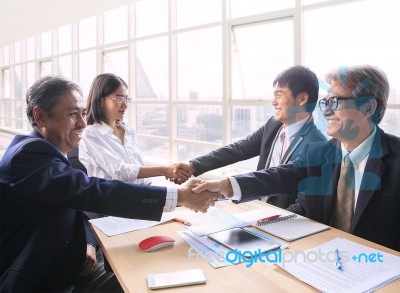 Team Of Man And Woman  Business People Successful Shaking Hand After Solution Meeting Agreement Shot In Office Room Stock Photo