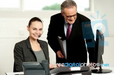 Team Of Two Business Executives Working In Office Stock Photo