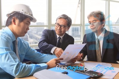 Team Of Young And Senior Engineering Man Project Meeting In Working Office For Project Discussion Stock Photo