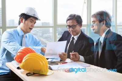 Team Of Young And Senior Engineering Man Project Meeting In Working Office For Project Discussion Stock Photo